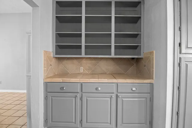 a view of cabinets and shelf