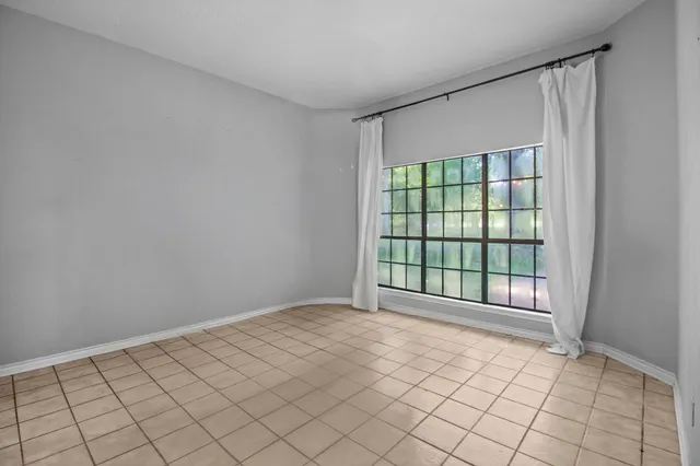 a view of an empty room and window