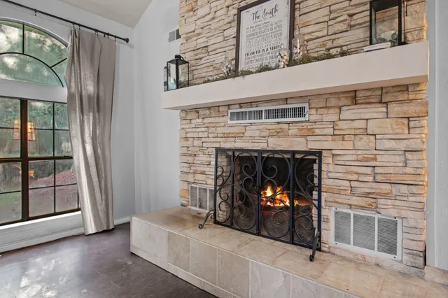 a living room with furniture and a fireplace