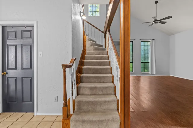 a view of entryway and hall with wooden floor