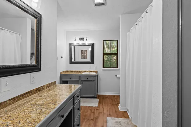 a kitchen with stainless steel appliances granite countertop a sink and a stove top oven