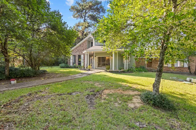 a house view with a garden space
