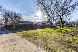 4036 Pringle Drive Dallas, TX 75212 - Photo 3 of 7 a view of a backyard with a large tree