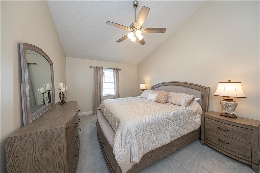 602 Hemlock Road Coraopolis, PA 15108 - Photo 19 of 40 a bedroom with a bed and a chandelier