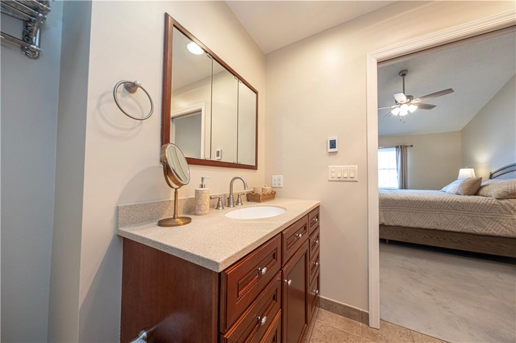 602 Hemlock Road Coraopolis, PA 15108 - Photo 20 of 40 a en suite bathroom with a double vanity sink and a mirror
