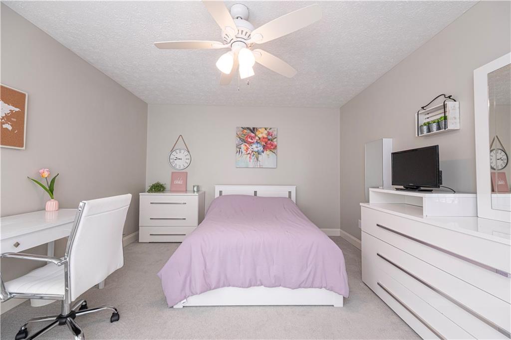 602 Hemlock Road Coraopolis, PA 15108 - Photo 25 of 40 a bedroom with a bed and a flat screen tv