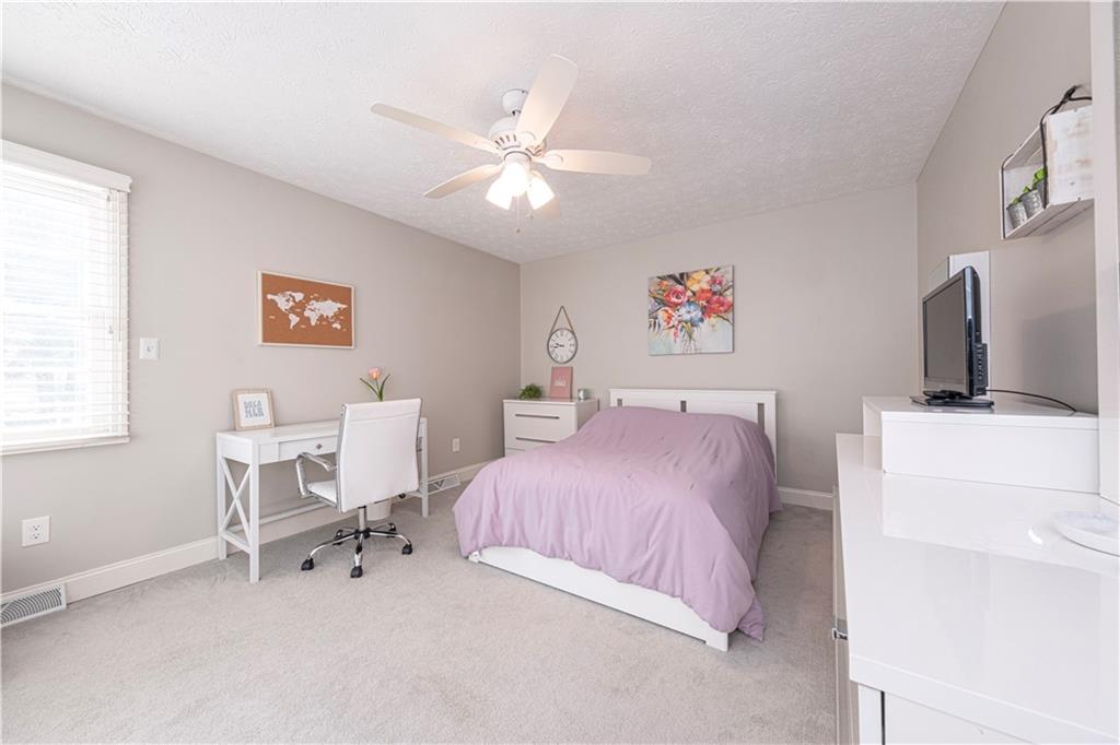 602 Hemlock Road Coraopolis, PA 15108 - Photo 26 of 40 a bedroom with a bed and a chair