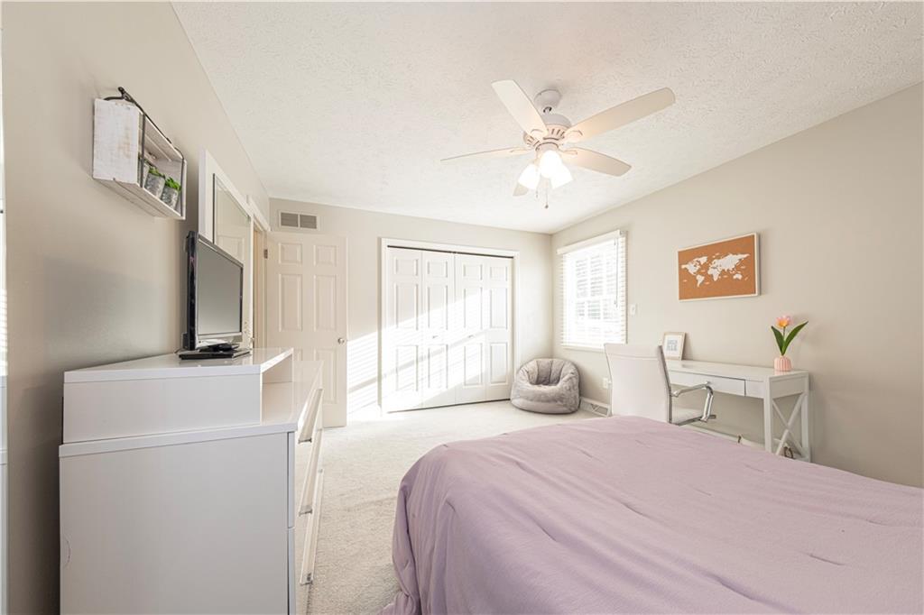 602 Hemlock Road Coraopolis, PA 15108 - Photo 27 of 40 a bedroom with a bed and a chandelier