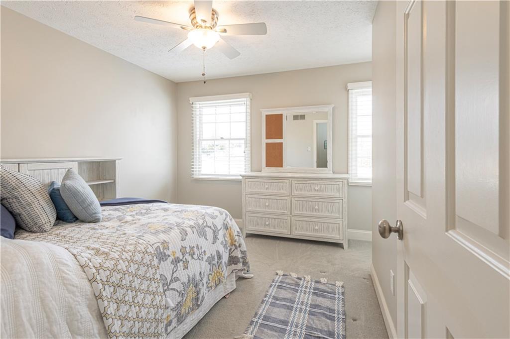 602 Hemlock Road Coraopolis, PA 15108 - Photo 28 of 40 a bedroom with a bed a dresser and a window