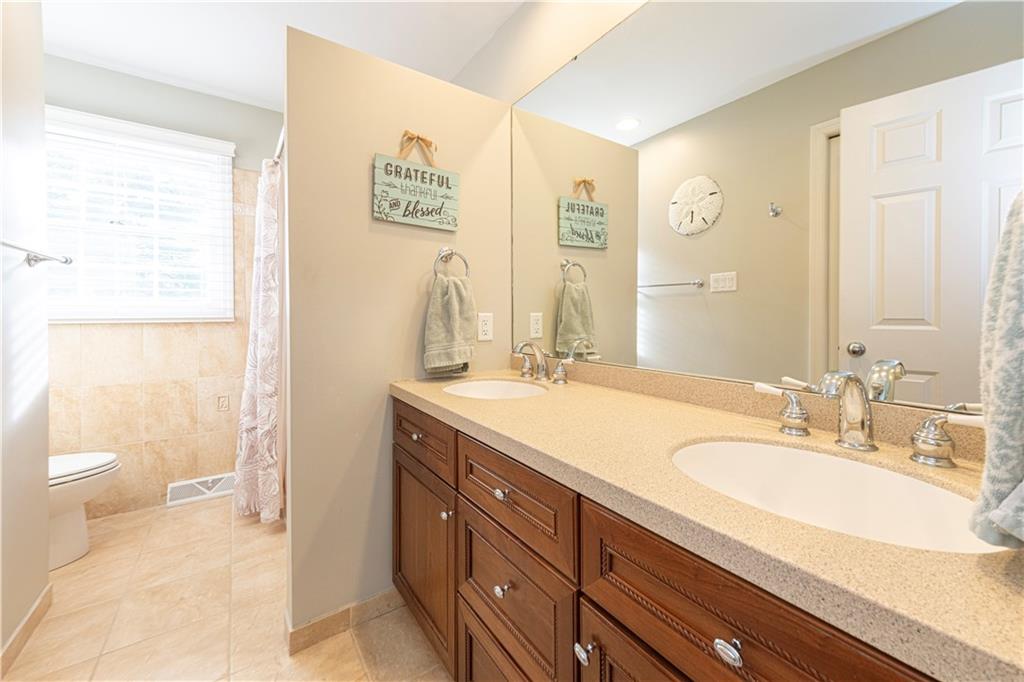 602 Hemlock Road Coraopolis, PA 15108 - Photo 31 of 40 a bathroom with a granite countertop sink toilet and shower