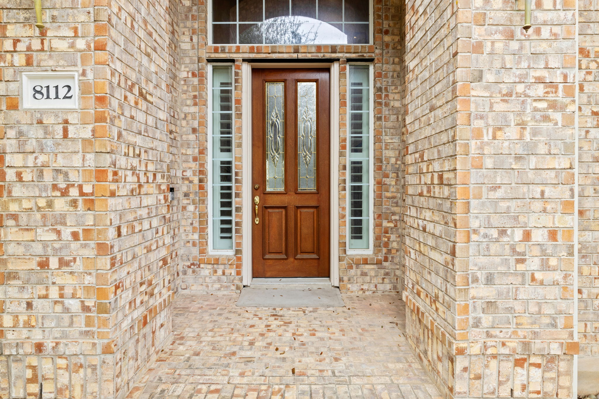 8112 Cobblestone Austin, TX 78735 - Photo 3 of 33 Doorway to property with brick siding