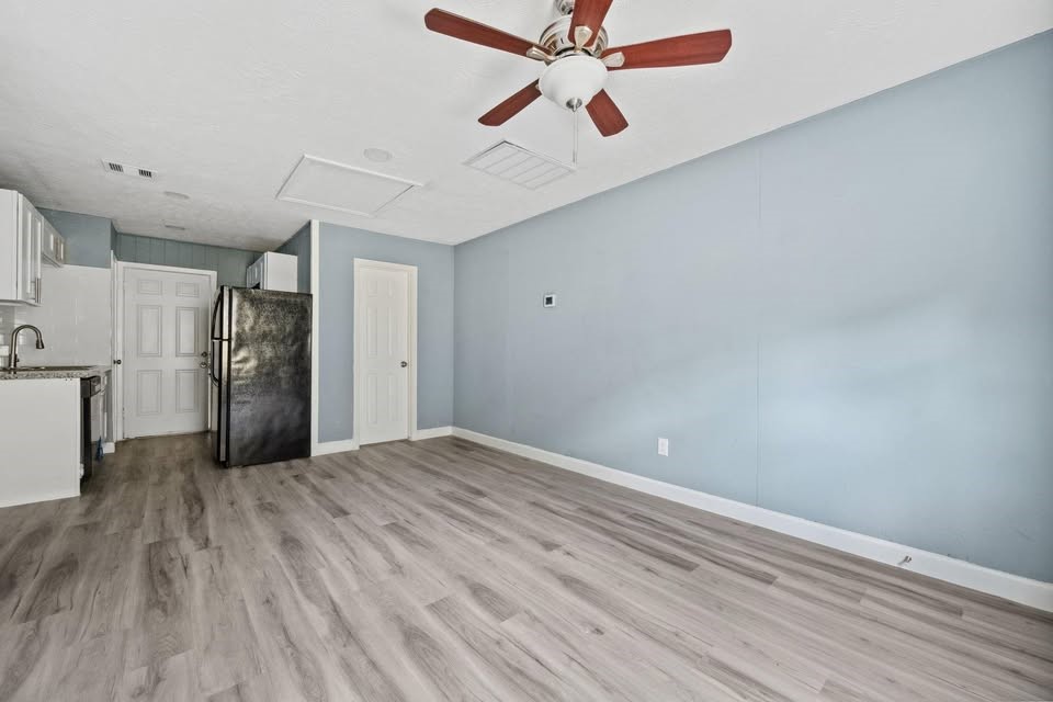 3425 Nettleton Street Houston, TX 77004 - Photo 8 of 12 a view of empty room with wooden floor