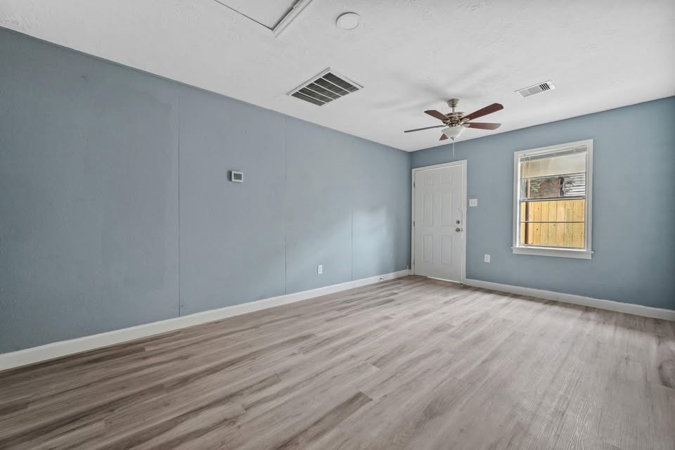 3425 Nettleton Street Houston, TX 77004 - Photo 10 of 12 wooden floor in an empty room with a window