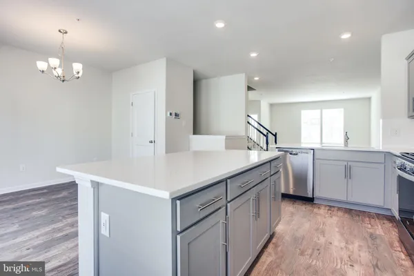 a kitchen with cabinets and window