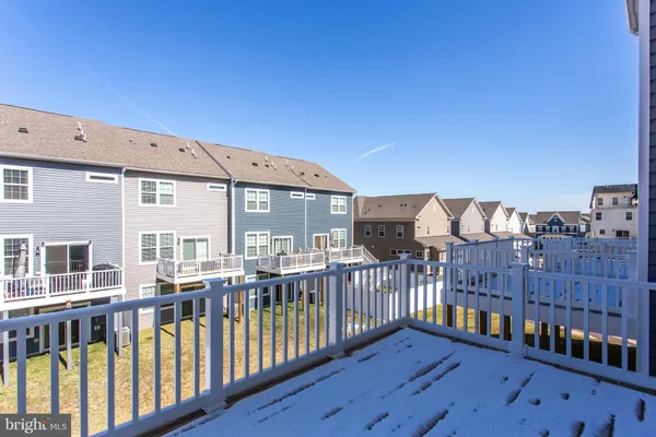 a view of a house with wooden deck