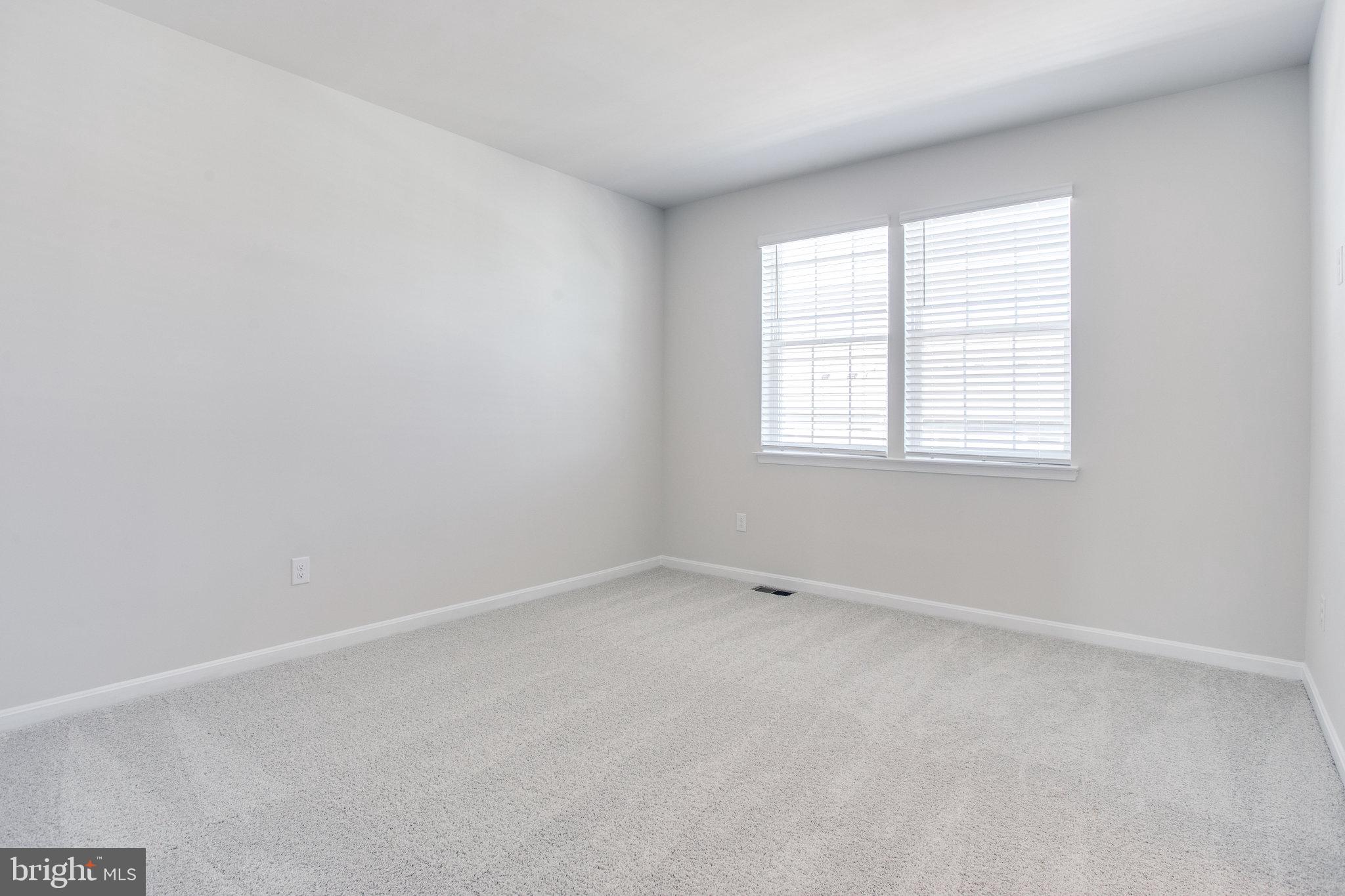 5039 MacDonough Place Frederick, MD 21703 - Photo 20 of 35 an empty room with a window