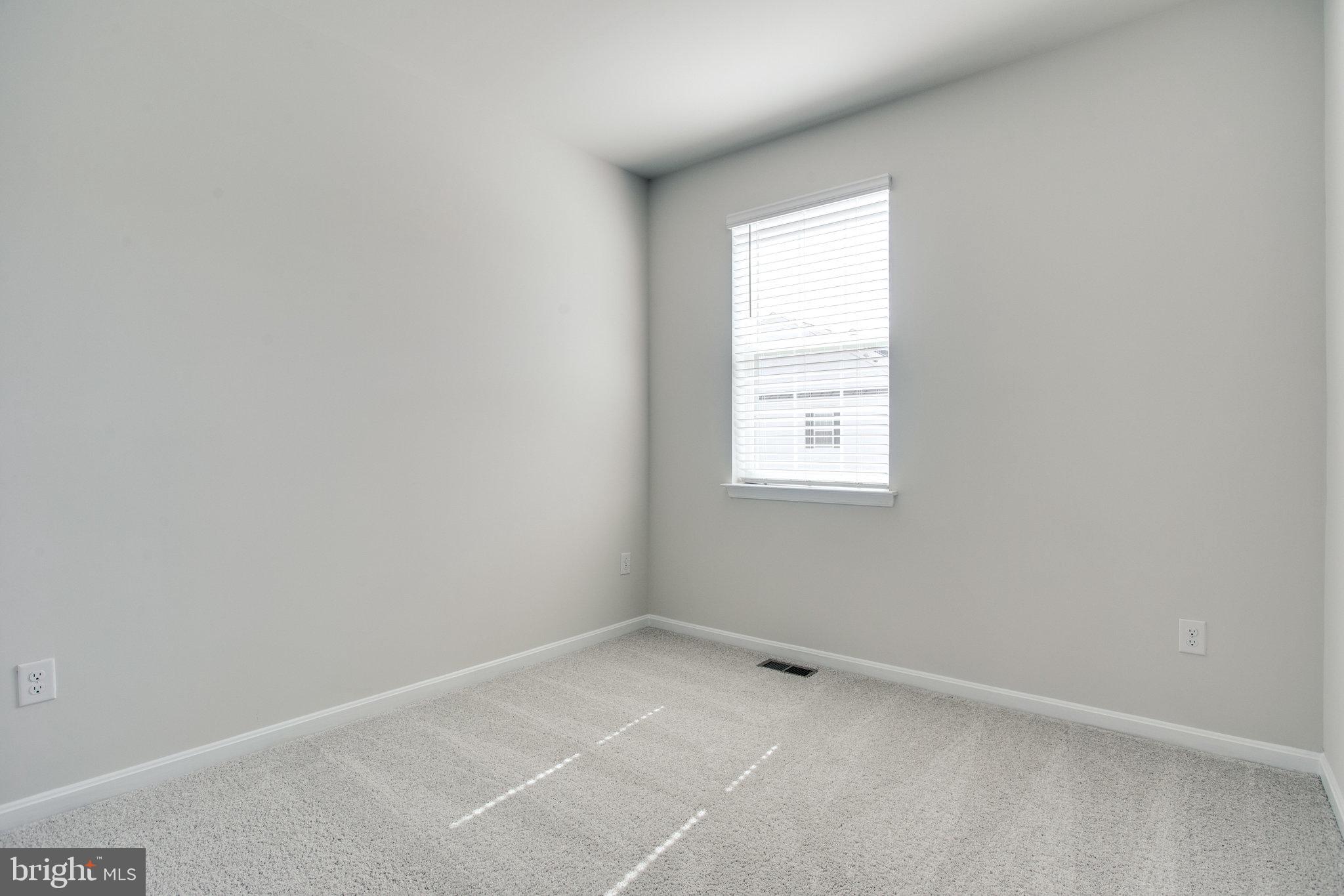 5039 MacDonough Place Frederick, MD 21703 - Photo 26 of 35 an empty room with a window