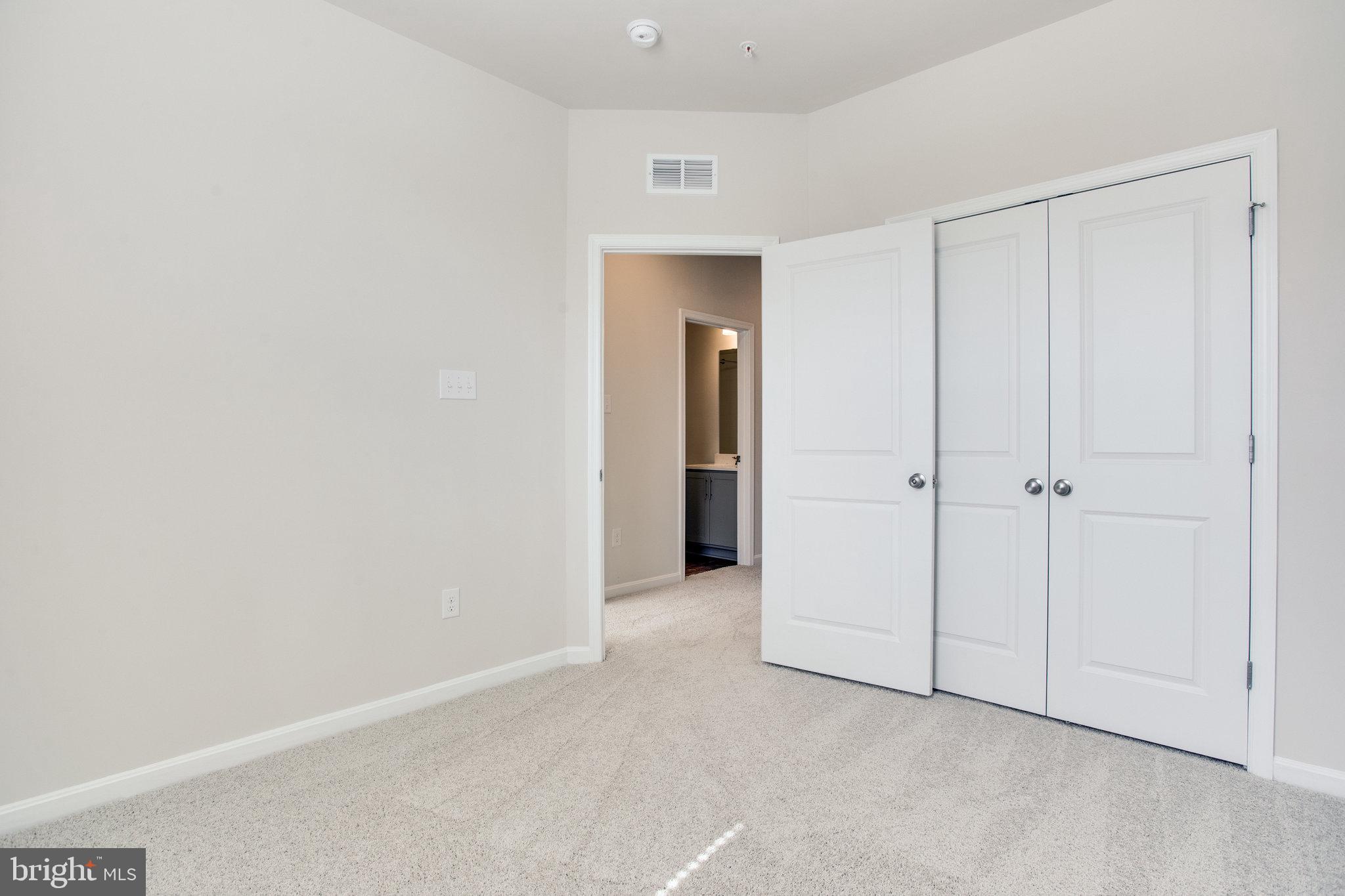 5039 MacDonough Place Frederick, MD 21703 - Photo 27 of 35 a view of an empty room and closet area