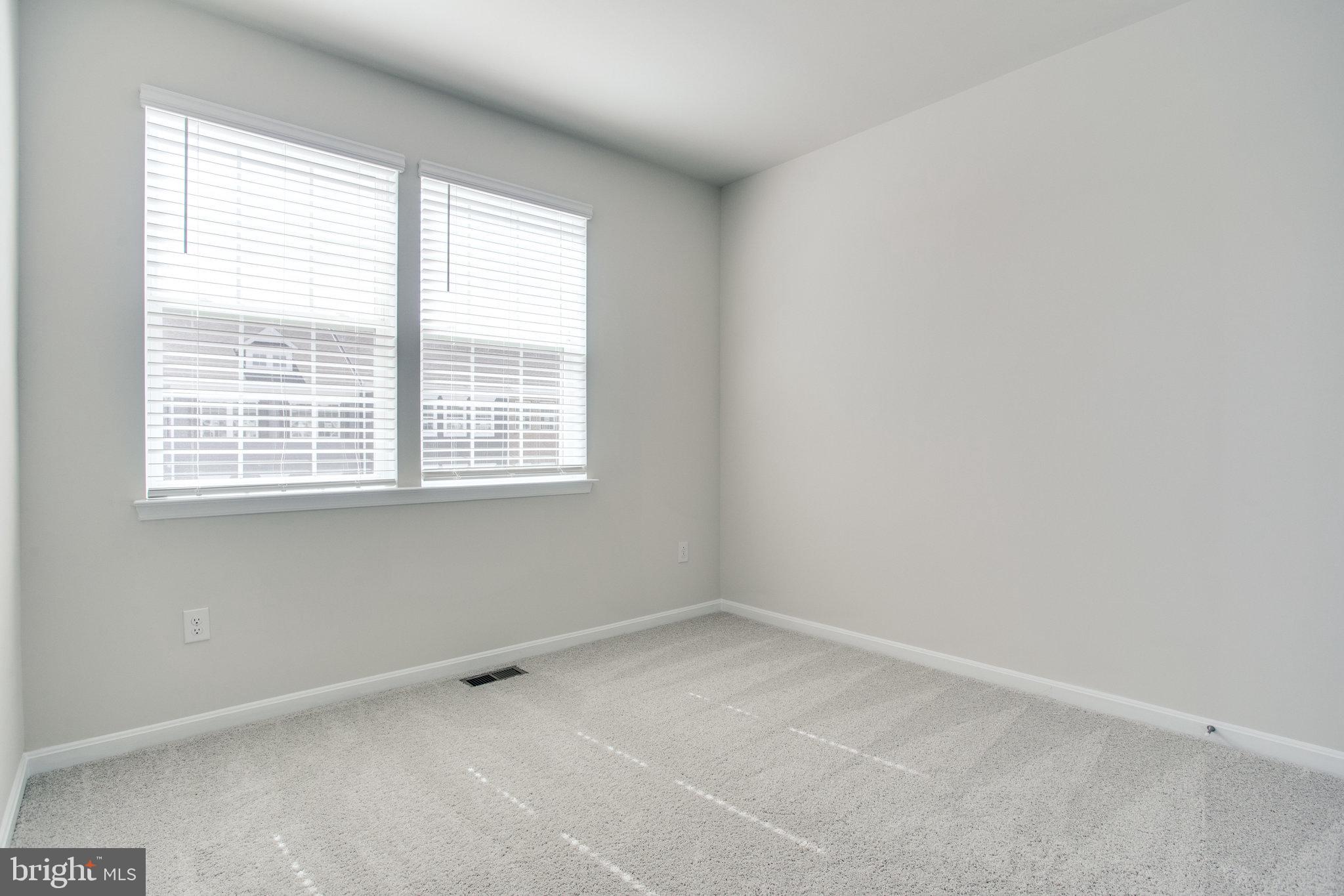 5039 MacDonough Place Frederick, MD 21703 - Photo 28 of 35 an empty room with a window