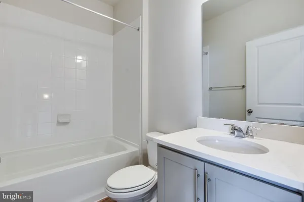 a bathroom with a sink toilet and bathtub