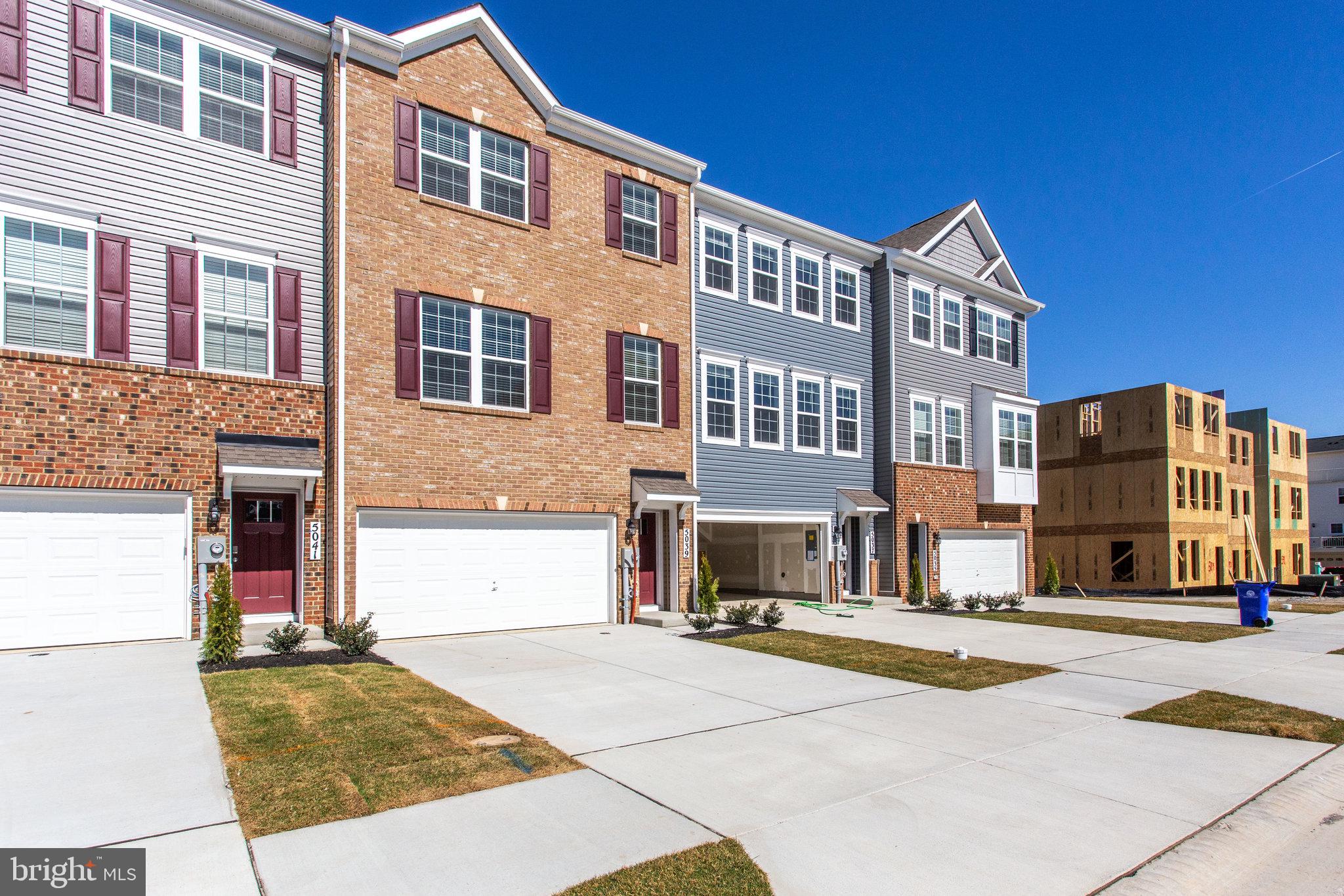 5039 MacDonough Place Frederick, MD 21703 - Photo 3 of 35 a building with a street view