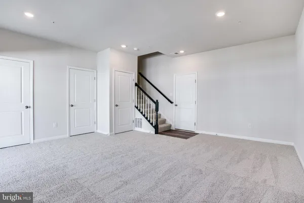 a view of an empty room with stairs