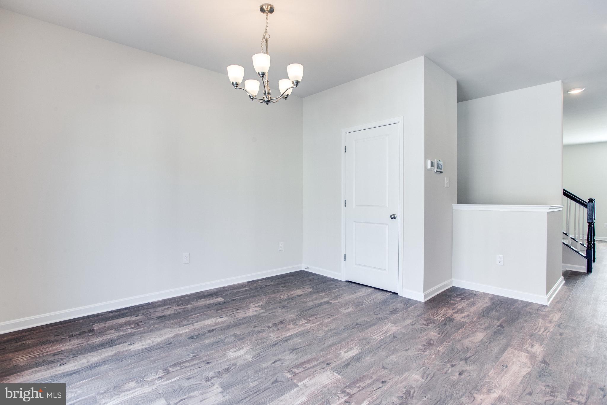 5039 MacDonough Place Frederick, MD 21703 - Photo 10 of 35 a view of livingroom with hardwood