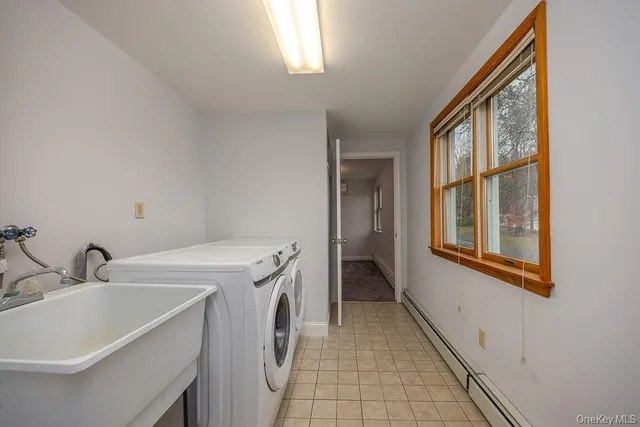 a utility room with dryer and washer