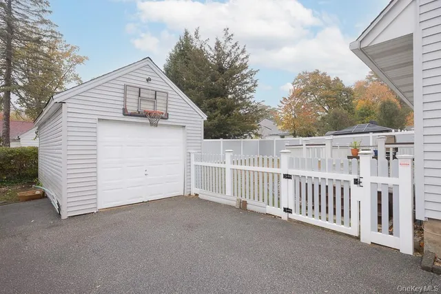 a view of a house with a wooden fence
