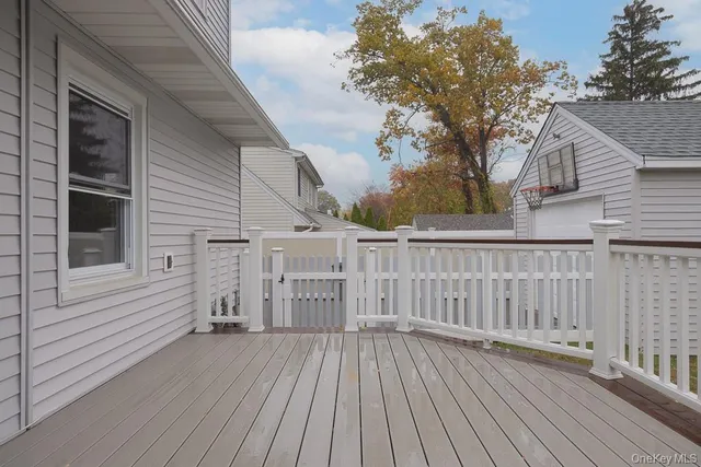 a view of a wooden deck and a yard