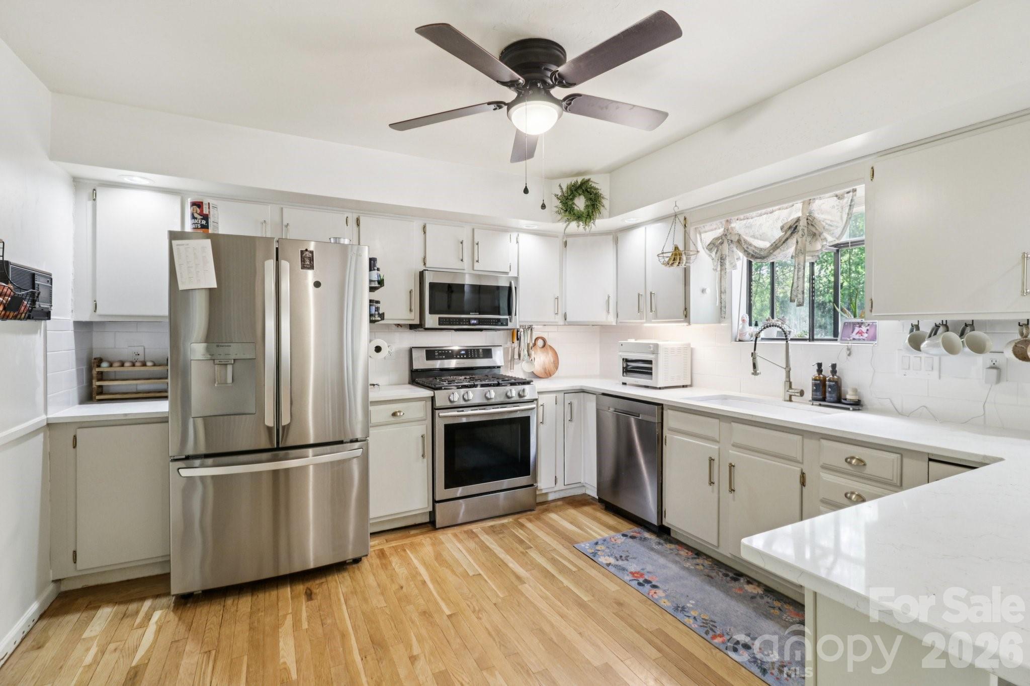 5483 Valley Run Street Hickory, NC 28601 - Photo 11 of 48 a kitchen with stainless steel appliances a refrigerator sink and cabinets