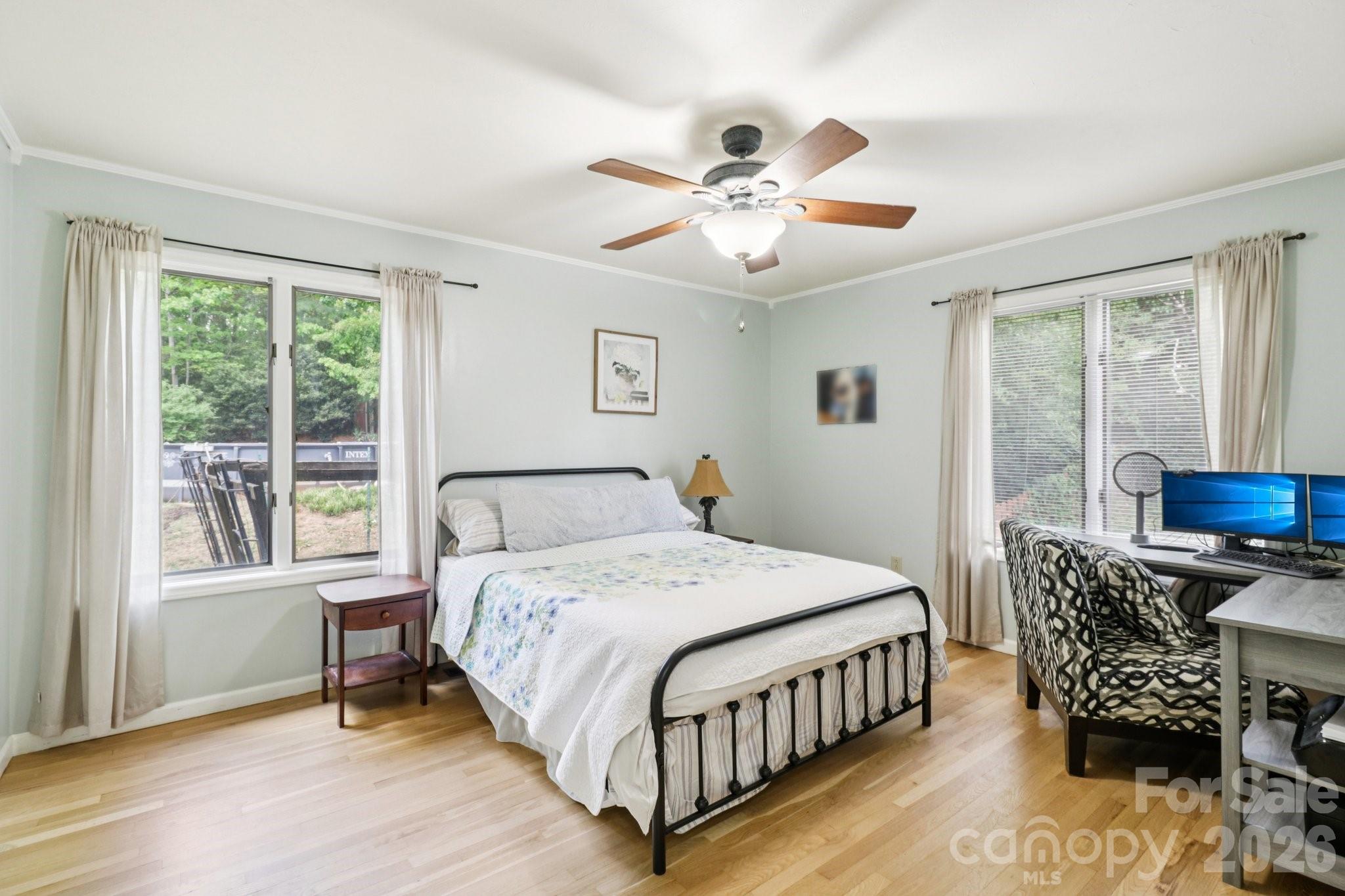 5483 Valley Run Street Hickory, NC 28601 - Photo 16 of 48 a bedroom with a bed and a chandelier