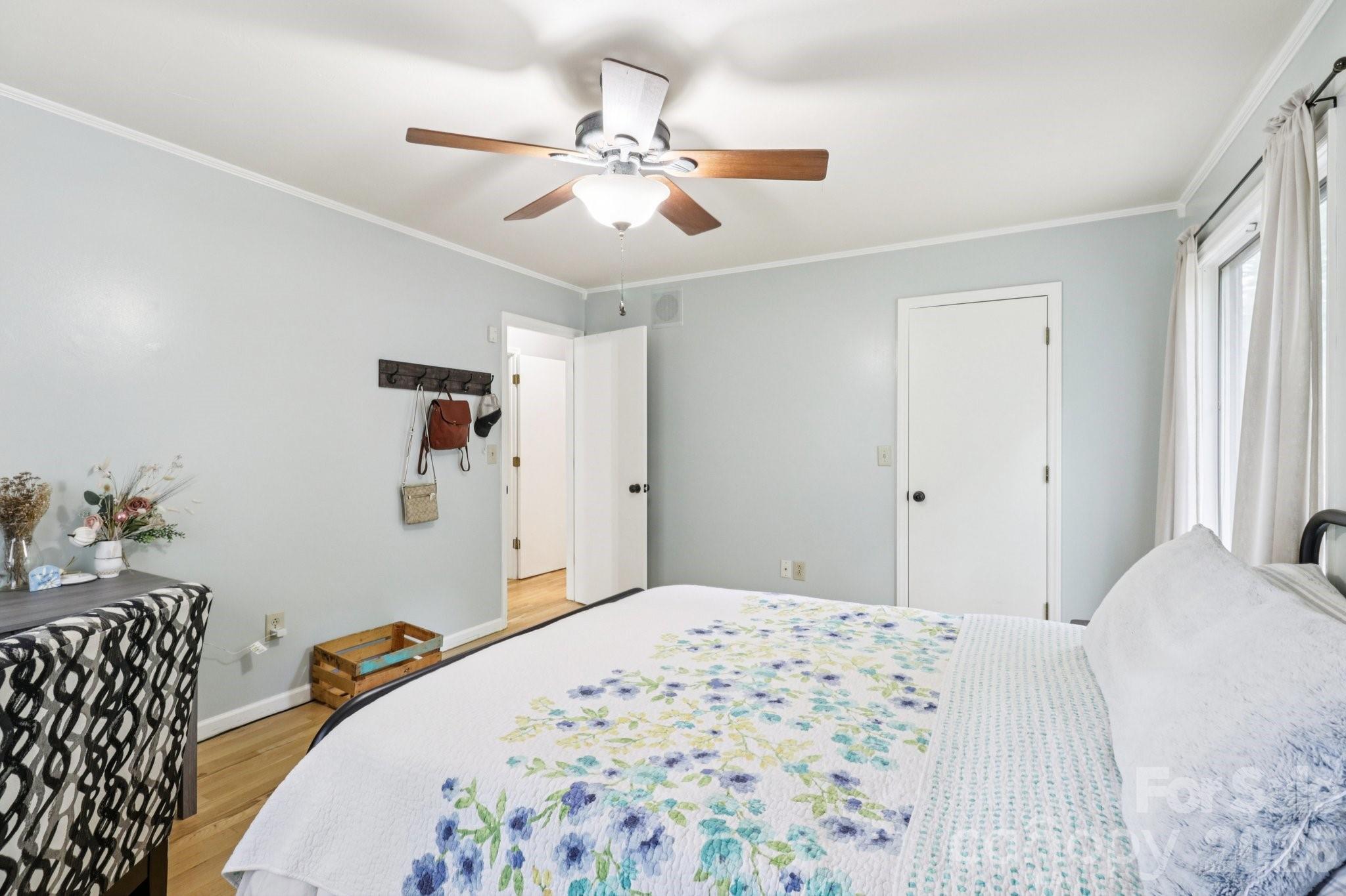 5483 Valley Run Street Hickory, NC 28601 - Photo 17 of 48 a bedroom with a bed and a chandelier