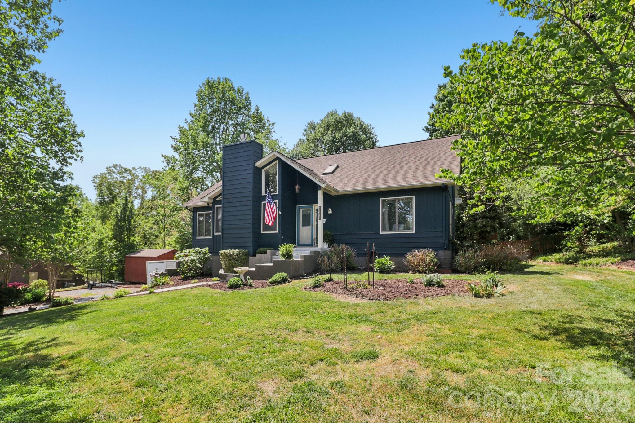 5483 Valley Run Street Hickory, NC 28601 - Photo 2 of 48 a view of a house with a yard and sitting area
