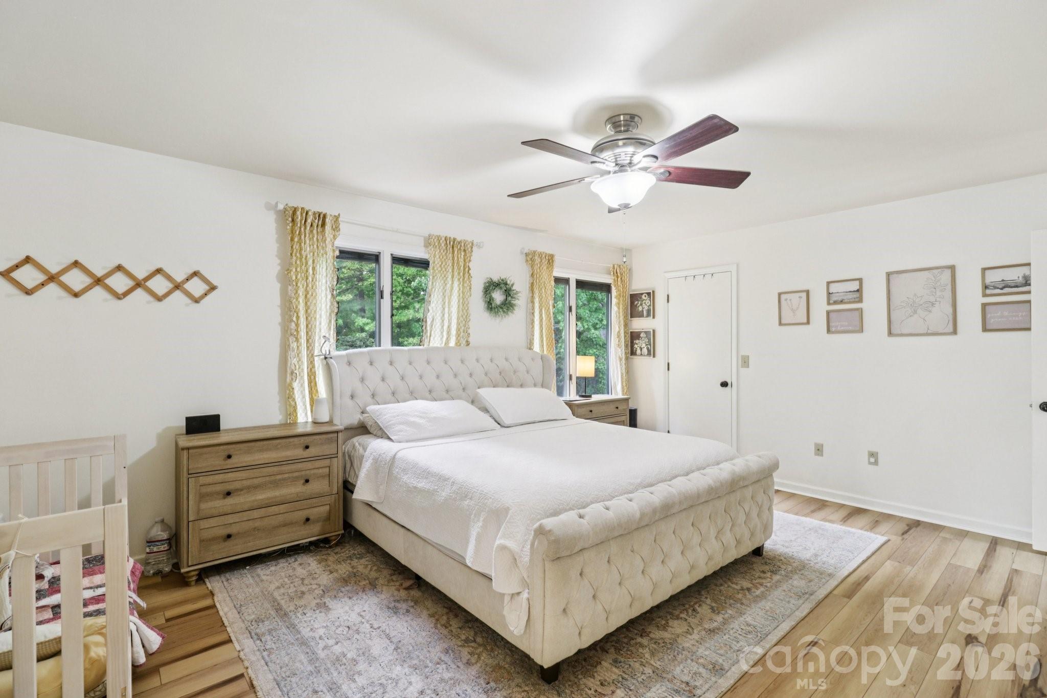 5483 Valley Run Street Hickory, NC 28601 - Photo 23 of 48 a bedroom with a large bed and a chandelier