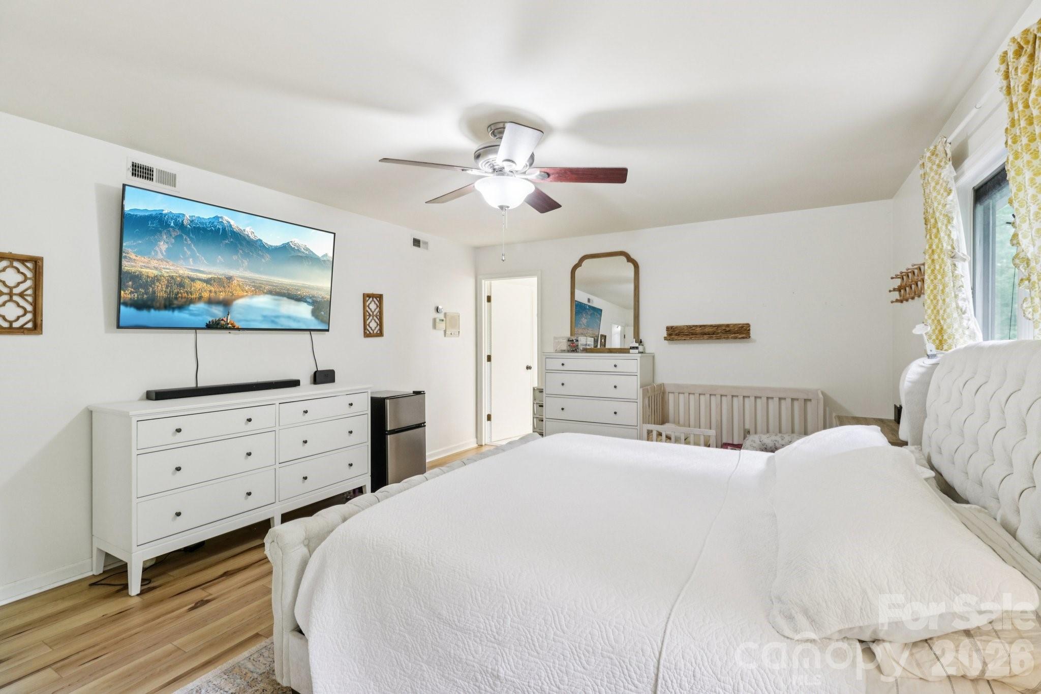 5483 Valley Run Street Hickory, NC 28601 - Photo 24 of 48 a bedroom with a bed and a chandelier