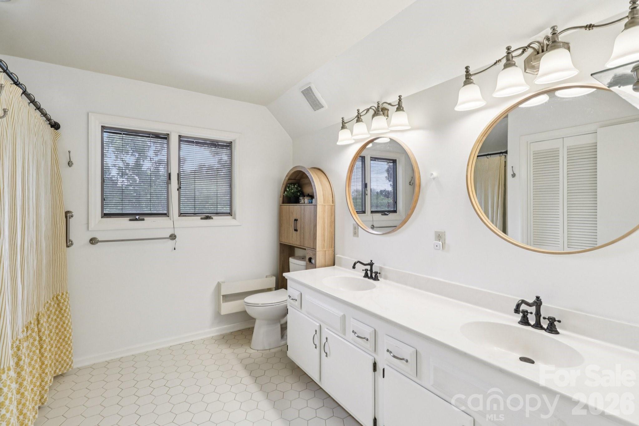5483 Valley Run Street Hickory, NC 28601 - Photo 25 of 48 a bathroom with a double vanity sink and a mirror