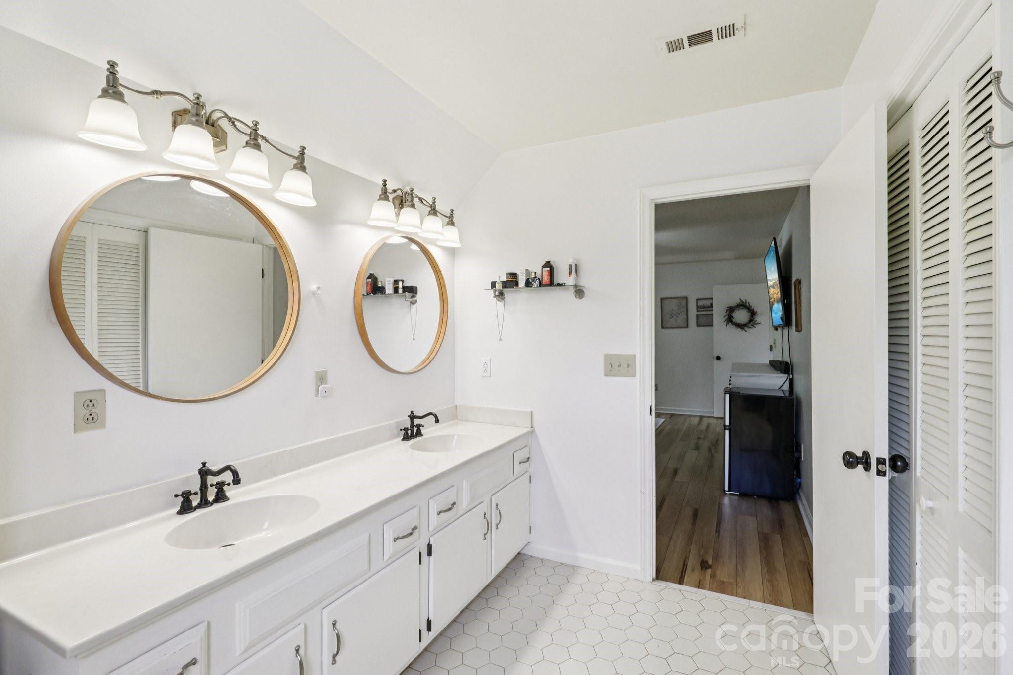 5483 Valley Run Street Hickory, NC 28601 - Photo 26 of 48 a bathroom with a double vanity sink and a mirror