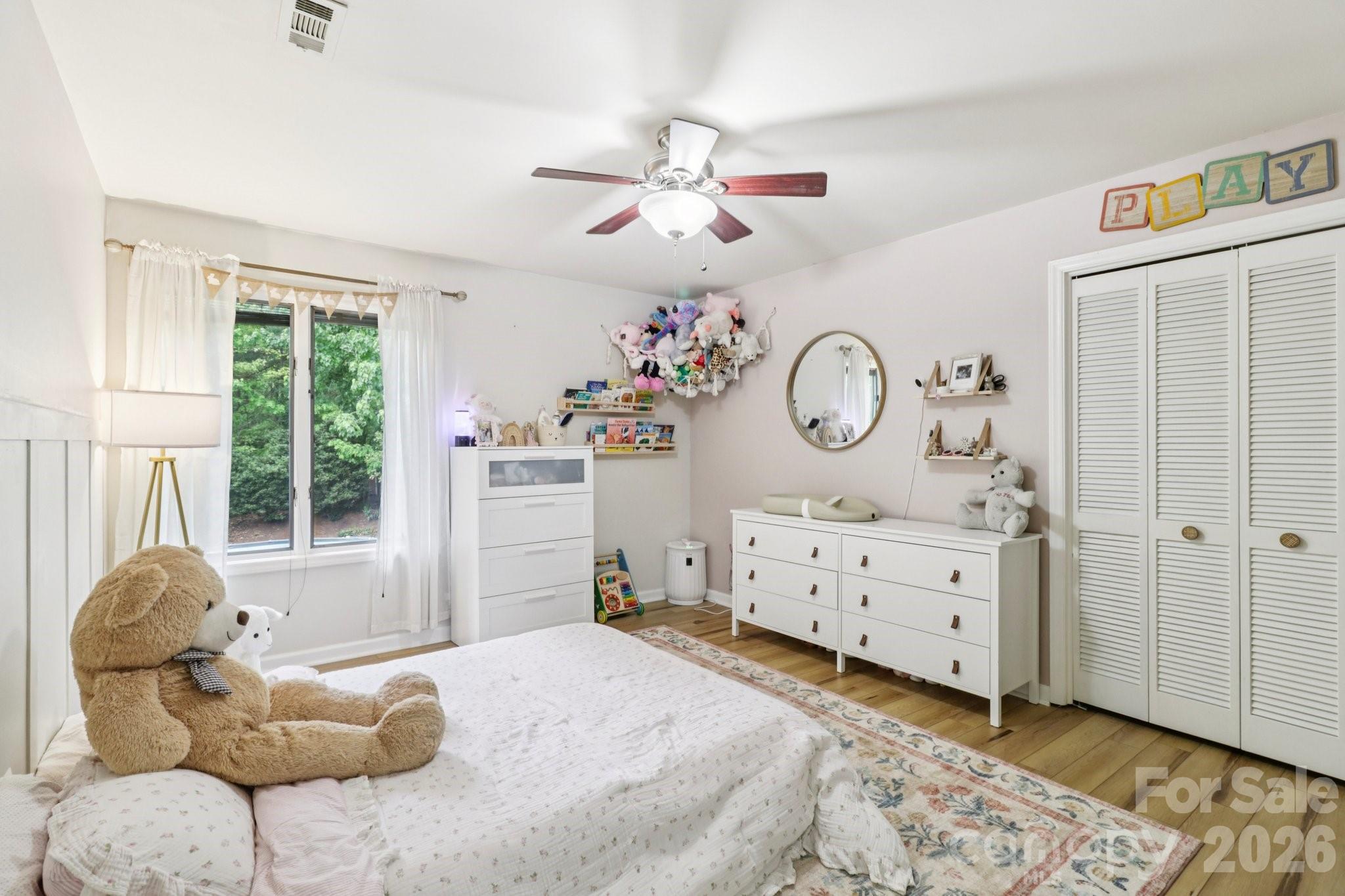 5483 Valley Run Street Hickory, NC 28601 - Photo 27 of 48 a bedroom with a bed and a chandelier
