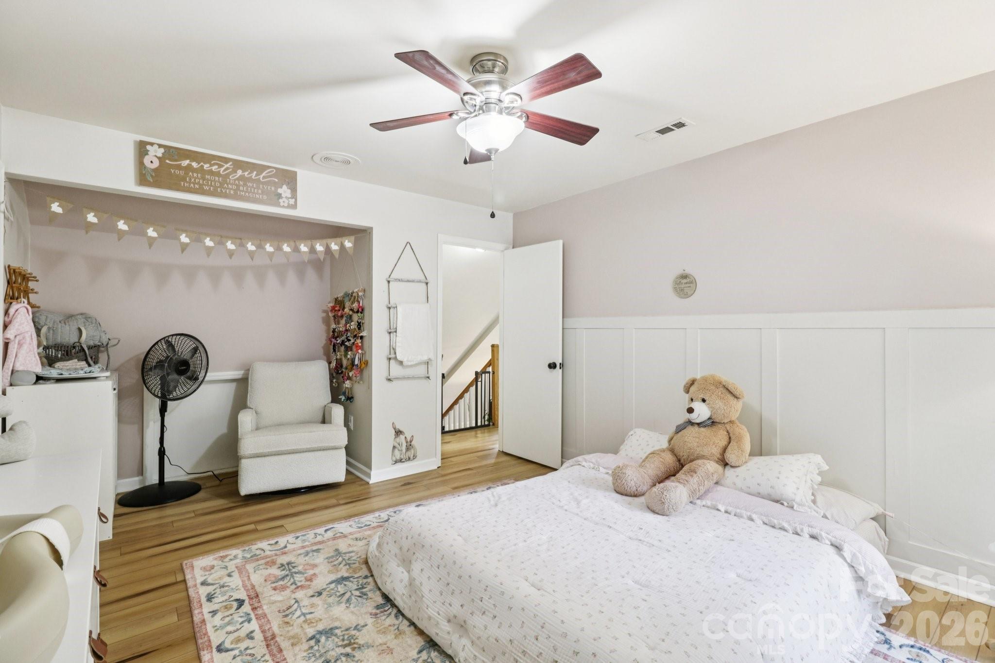 5483 Valley Run Street Hickory, NC 28601 - Photo 28 of 48 a bedroom with a bed and a chandelier