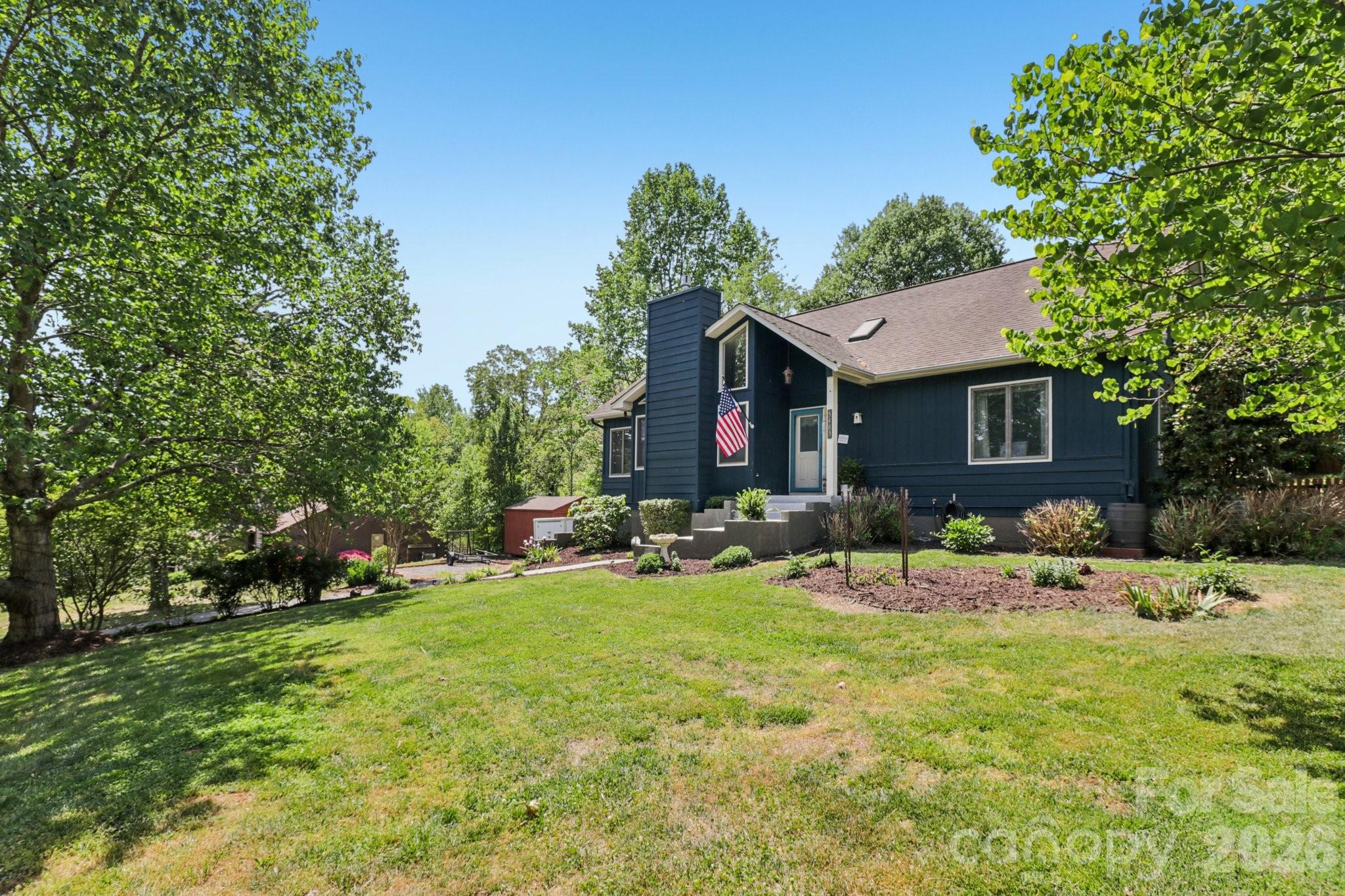 5483 Valley Run Street Hickory, NC 28601 - Photo 44 of 48 a view of a house with backyard sitting area and garden