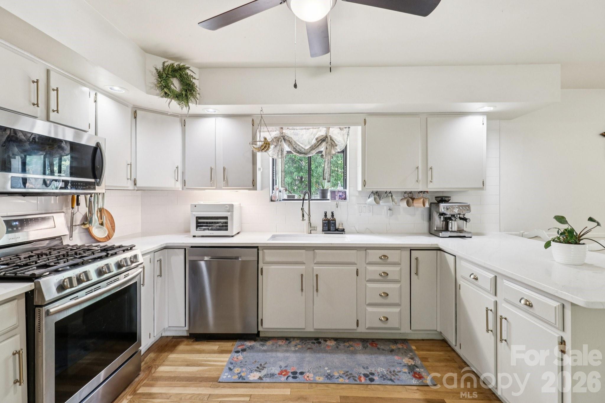 5483 Valley Run Street Hickory, NC 28601 - Photo 10 of 48 a kitchen with granite countertop a sink stainless steel appliances and cabinets