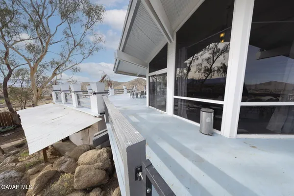 a view of a yard with snow on the road