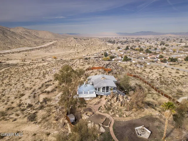 a view of a balcony with wooden floor