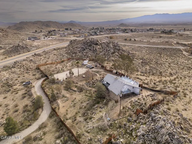 a view of a livingroom with furniture and mirror