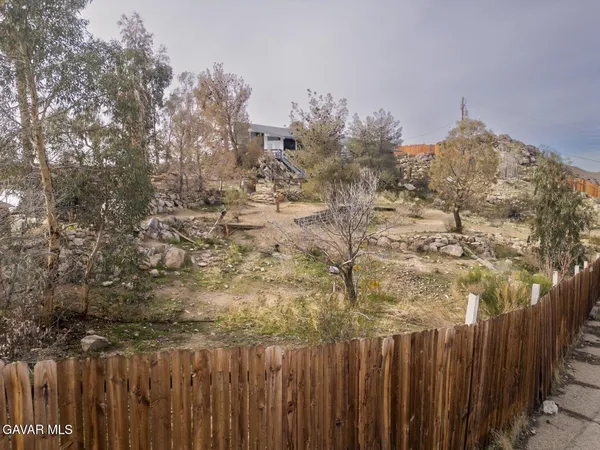 a view of a house with a snow in the yard