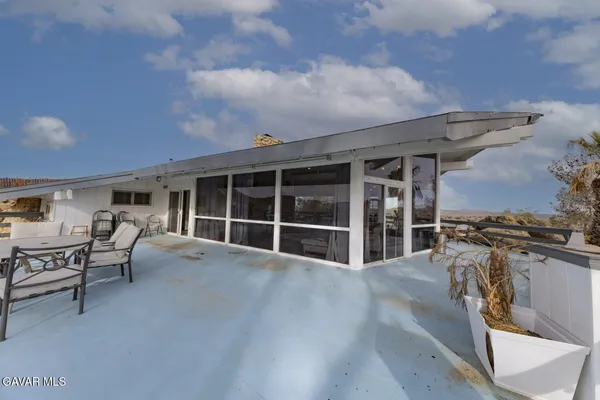 a view of a building from a glass door