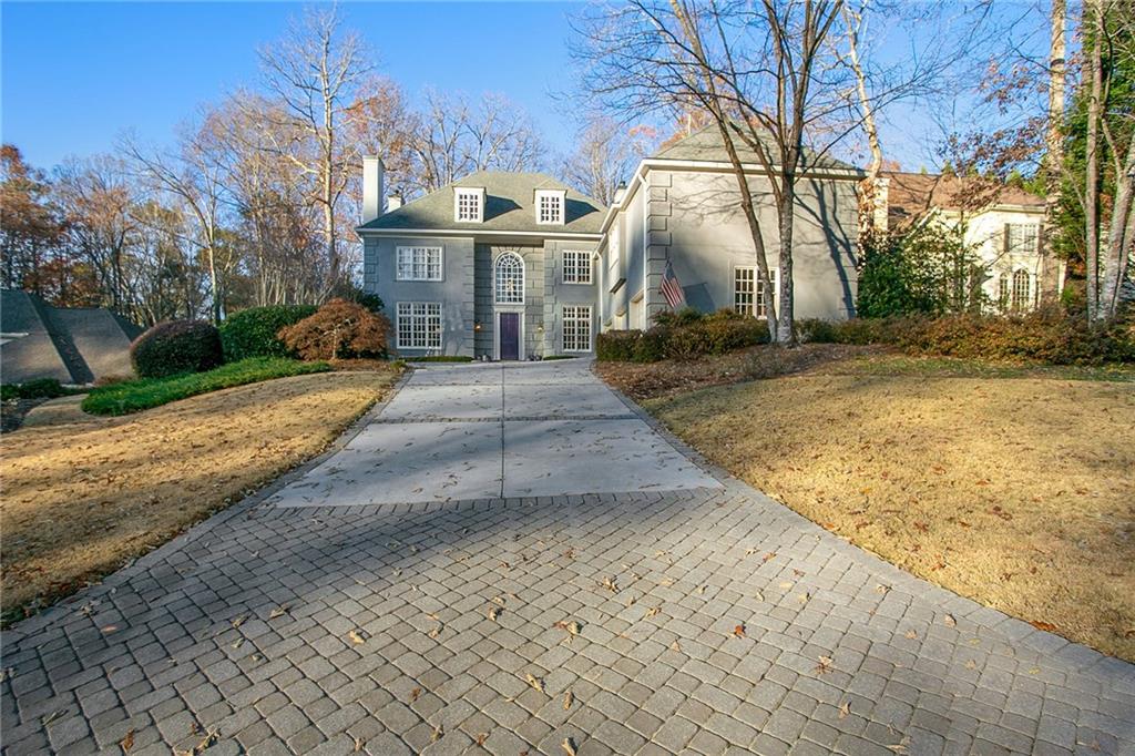 Family-friendly, larger than it looks, Sara Smith School District, cobblestone driveway skirt, concrete drive, brick accents to large motor court & 3-car garage