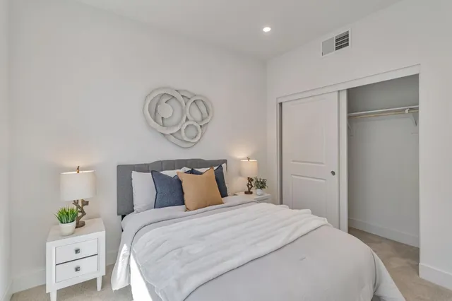 a bedroom with a bed and a closet