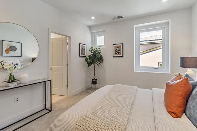 a bedroom with a bed and a dresser